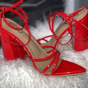 Fire red heels. Never worn. 4 inch square heel. Triangle toe. Strappy heel.